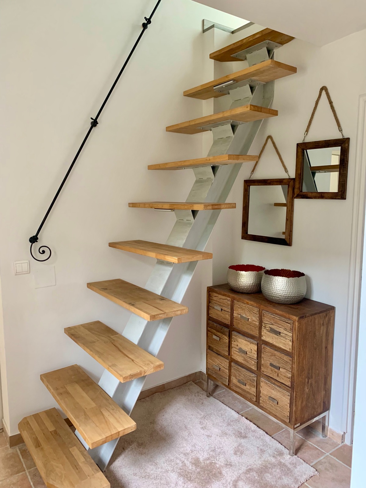 Steep open-tread staircase to the loft at Villa Augflor