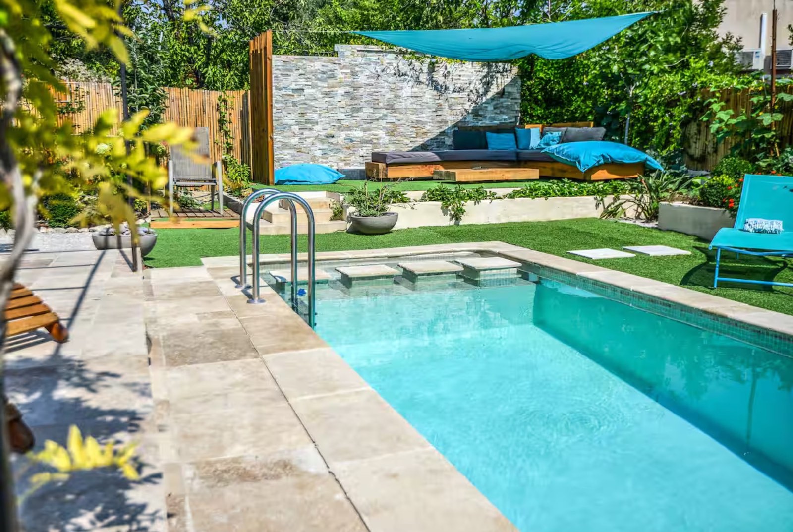 Summer pool time with family loungers and garden shade